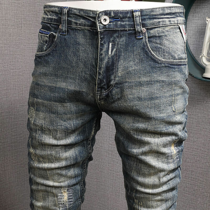 Streetwear moda uomo Jeans Retro blu elastico Slim Fit Jeans strappati Vintage uomo stampato Designer pantaloni Hip-Hop in Denim Hombre