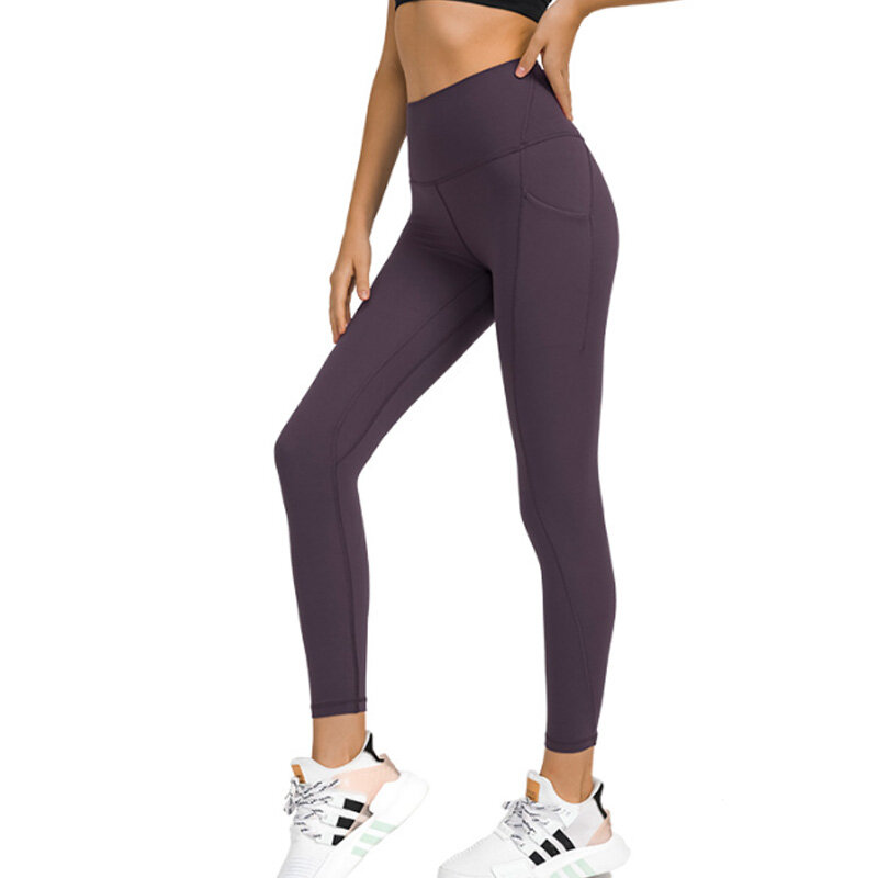 As caneleiras da cintura alta com bolsos para mulheres, calças dos esportes, gym, aptidão, controle da barriga, correndo, treinando