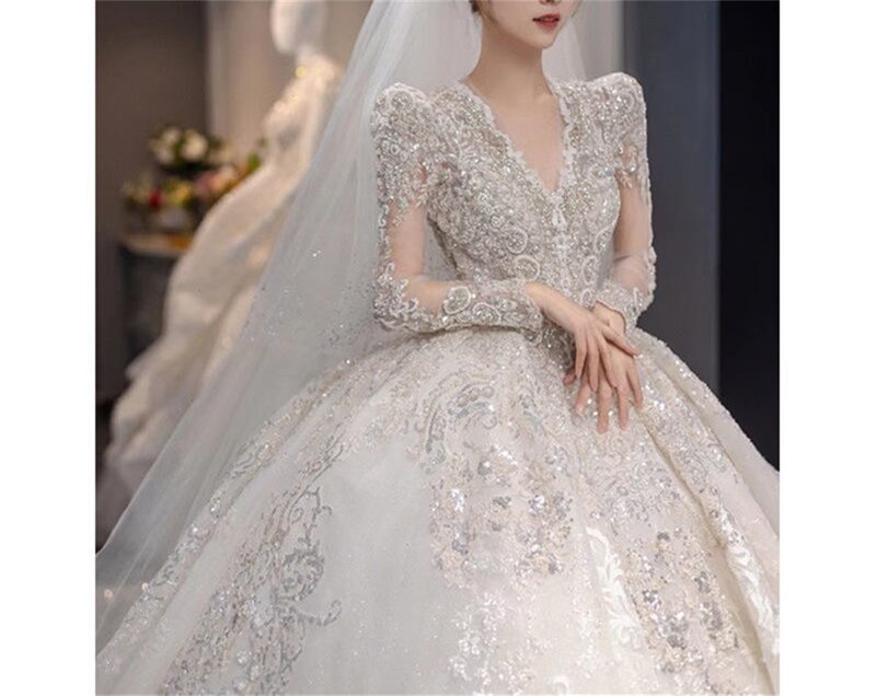 Dubaj Arabia suknia ślubna suknia V Neck długie rękawy kryształ olśniewająca perła ślubna suknia Vestido De Novia Robe De Mariée
