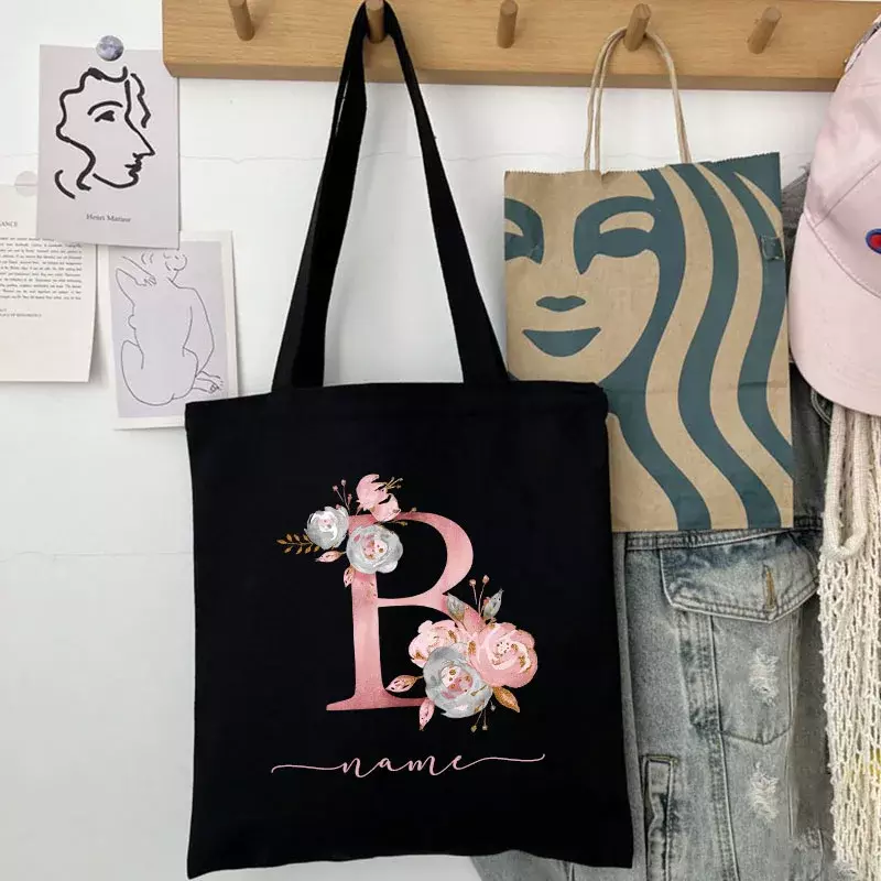 Neue schwarze personal isierte kunden spezifische Name Mode Frauen rosa Blume Brief Leinwand Tasche Freizeit einkaufen große Kapazität Falt geschenk