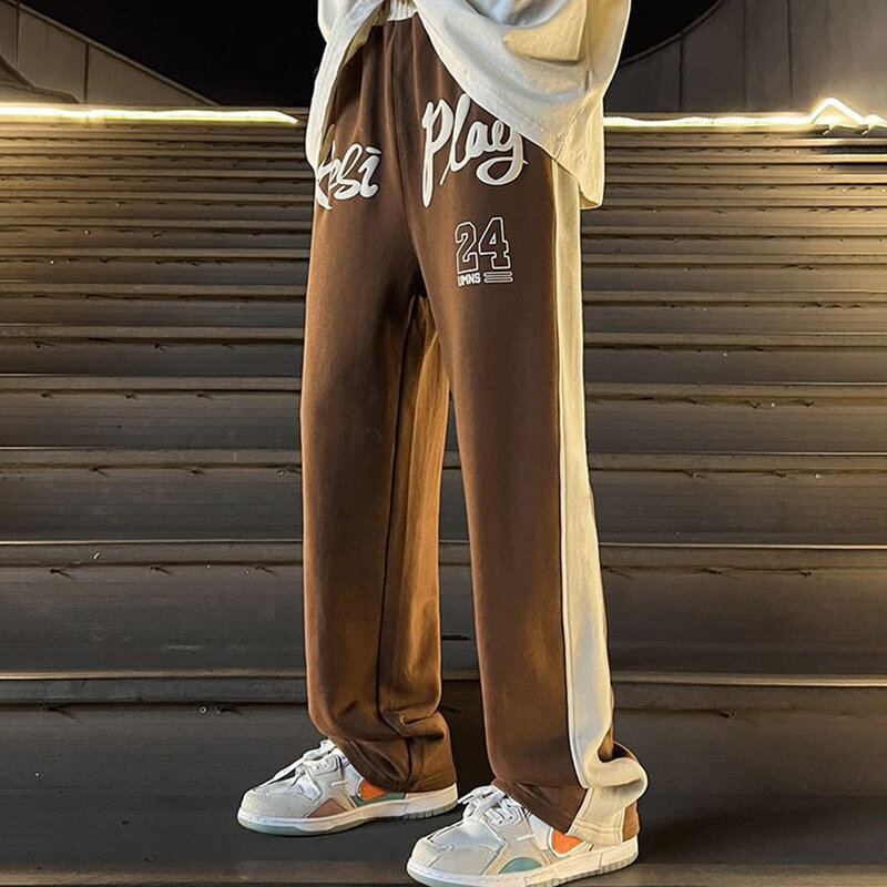 Pantaloni sportivi a contrasto di colore con giunture in stile americano pantaloni a gamba larga con lettera da uomo pantaloni sportivi larghi di marca alla moda di sport di strada