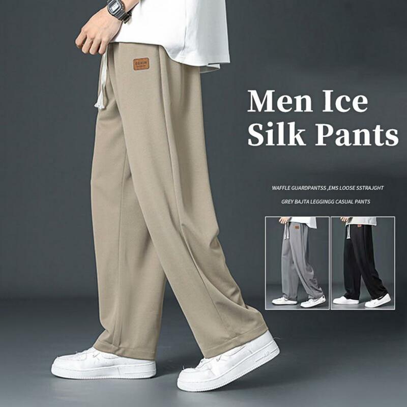 Calça confortável de perna larga masculina, calça respirável de seda gelada, cintura elástica, calça de rua elegante, verão