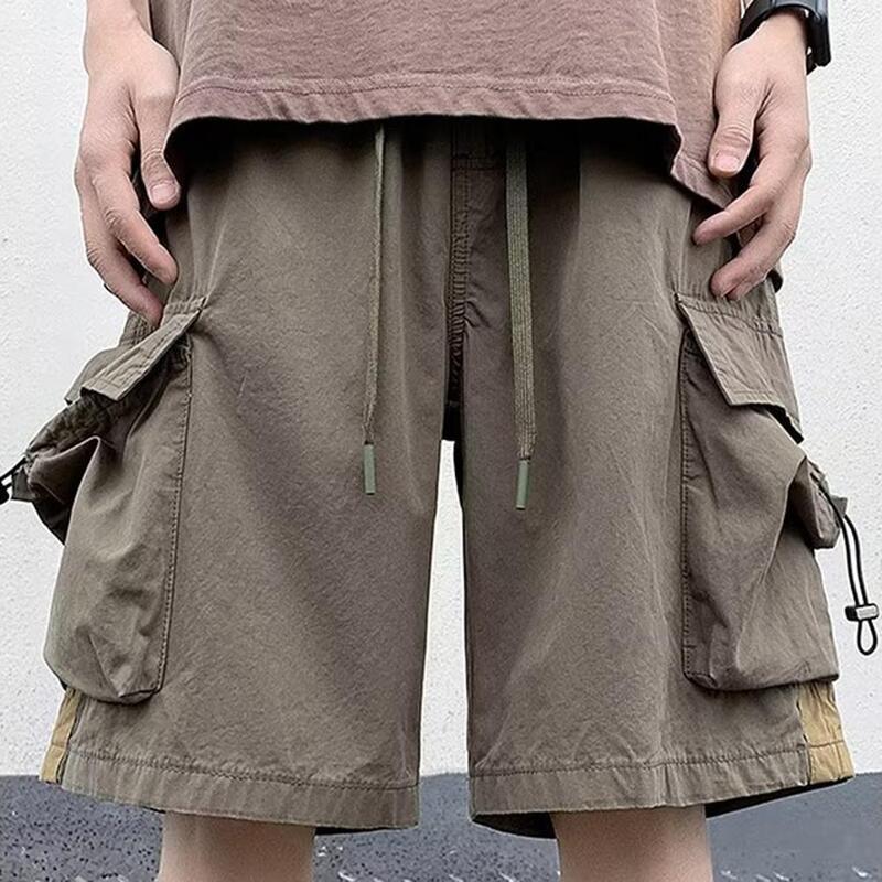 Calções de carga de cintura média masculina, elástico na cintura, cordão ajustável, bolsos múltiplos, streetwear de perna larga