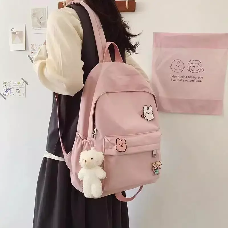 Mochila escolar Unisex Harajuku de gran capacidad, colgante de oso Ins, patrón de letras, bolsa de estudiante para enviar colgante e insignia