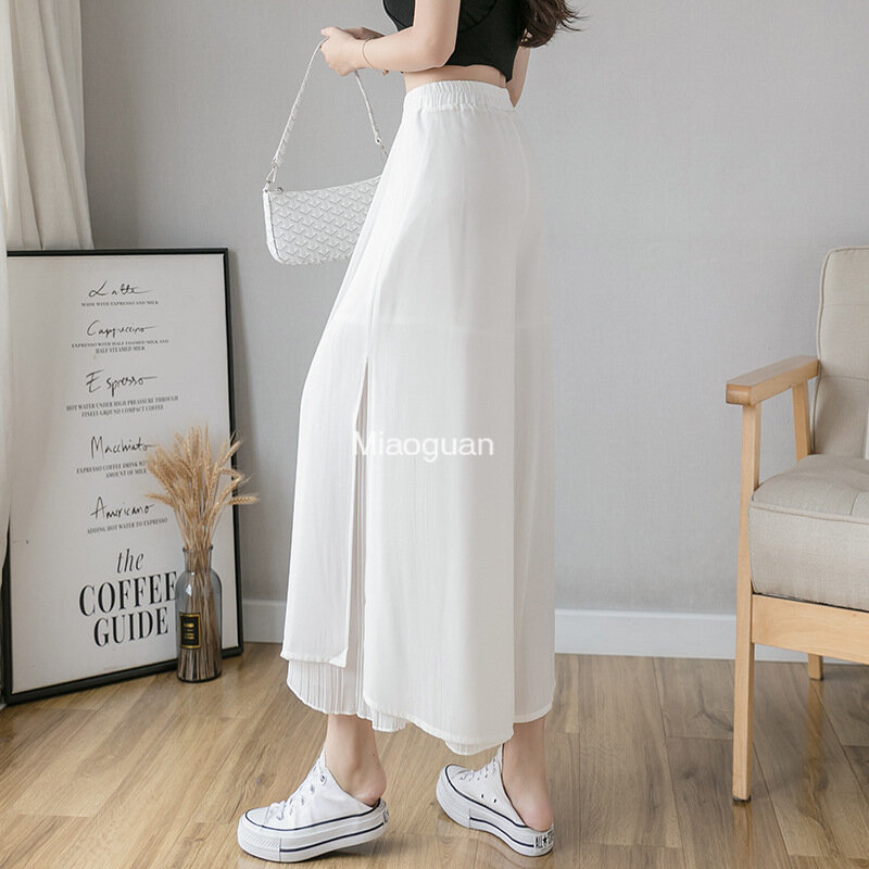 Celana wanita Korea, kulot elastis kaki lebar Hem tidak beraturan lapisan ganda celana musim panas kasual longgar celana lipit bernapas