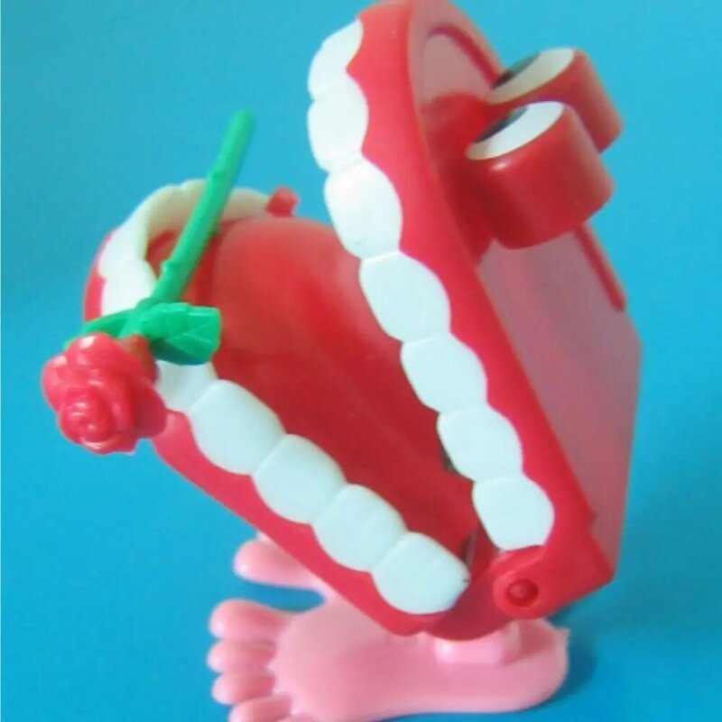Juguete de relojería de plástico con forma de rosa y dientes para caminar, juguete de relojería para dentadura pequeña, divertido