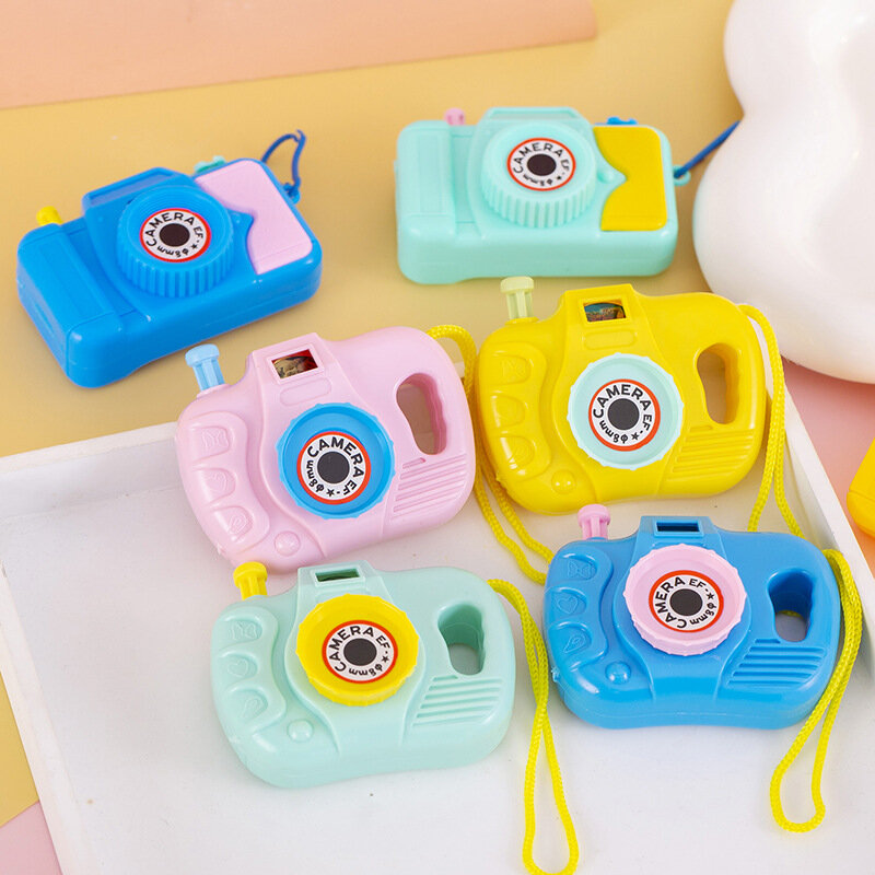 La telecamera di proiezione per bambini piccoli gioca a bagliore regali per l'asilo per ragazzi e ragazze o decorazioni