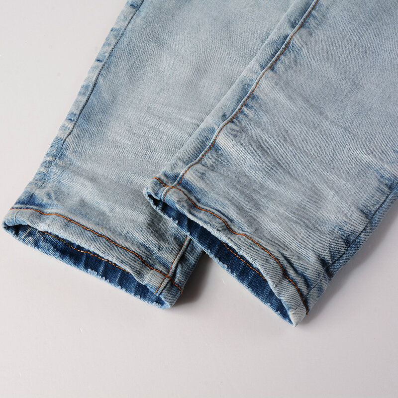 Główna ulica modne dżinsy męskie światło Retro niebieski odcinek chudy krój porwane jeansy mężczyzn łatał projektanta Hip hopu markowe spodnie Hombre