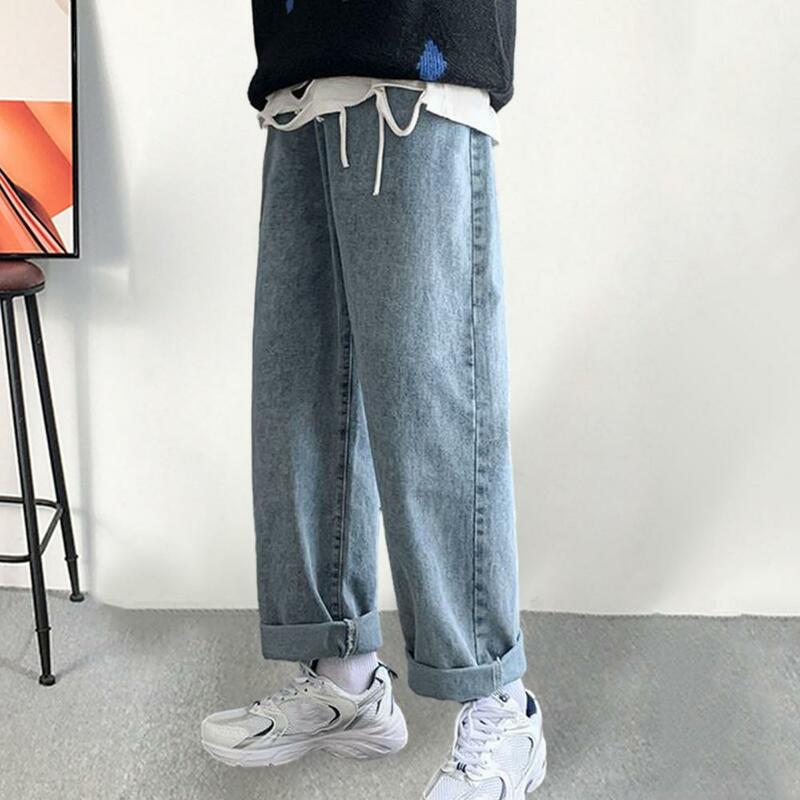 Wygodne guziki jeansy w stylu Streetwear spodnie męskie luźne prosty krój dżinsy z szeroką nogawką z guzikami w połowie wzrostu