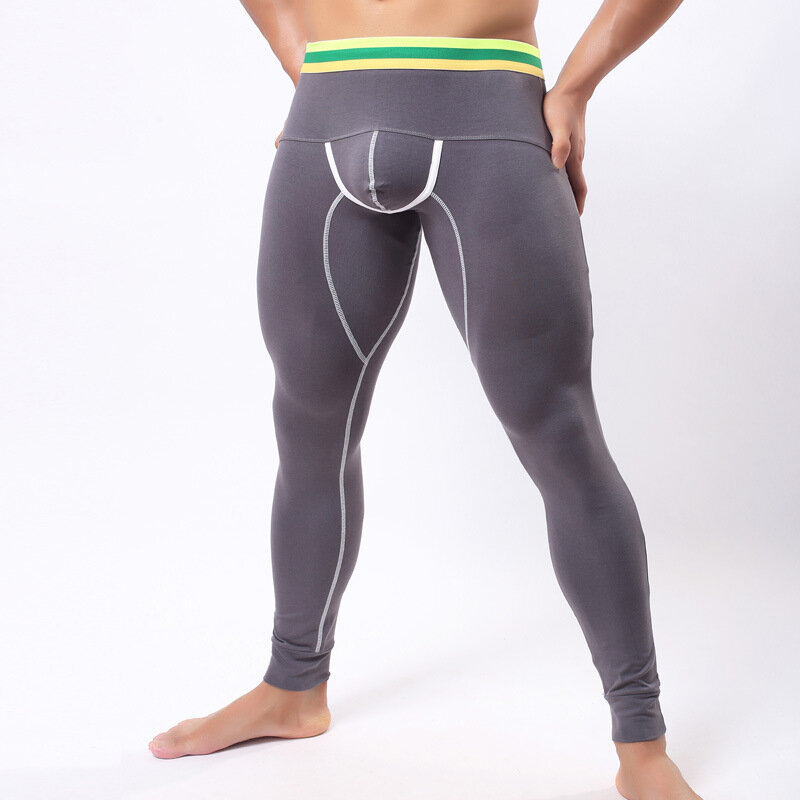Celana panjang katun pria baru celana termal ramping seksi U naik dengan warna solid meregang sembilan poin celana Bawahan tidur