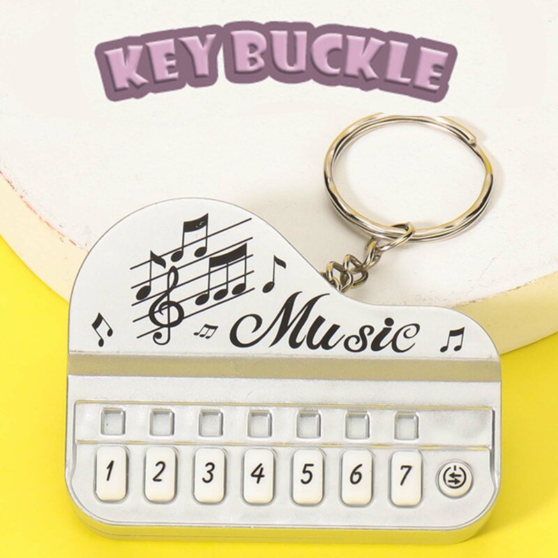 พวงกุญแจเปียโนนิ้วมืออิเล็กทรอนิกส์แฟชั่นเครื่องดนตรีแบบพกพาพวงกุญแจเปียโนสำหรับสำนักงานบ้านเดินทาง