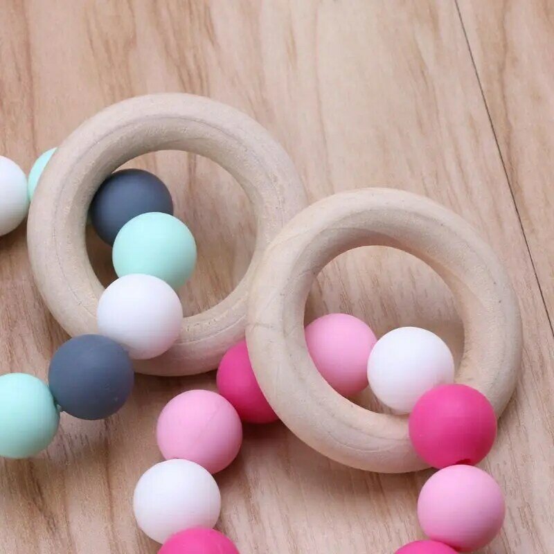 2022 nuovi braccialetti per allattamento per bambini massaggiagengive in legno Silicone perline da masticare sonagli per dentizione giocattoli massaggiagengive braccialetti Montessori