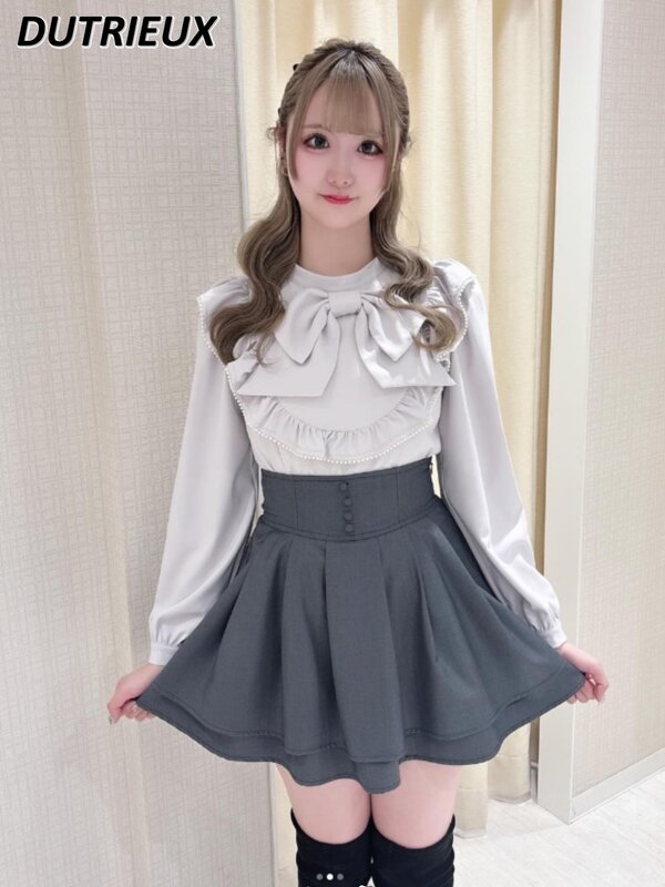 Japońska masowo produkowana duża kokarda koszula z długim rękawem dla kobiet Lolita słodka kokardka delikatna, dopasowana, biała bluzka z falbanką
