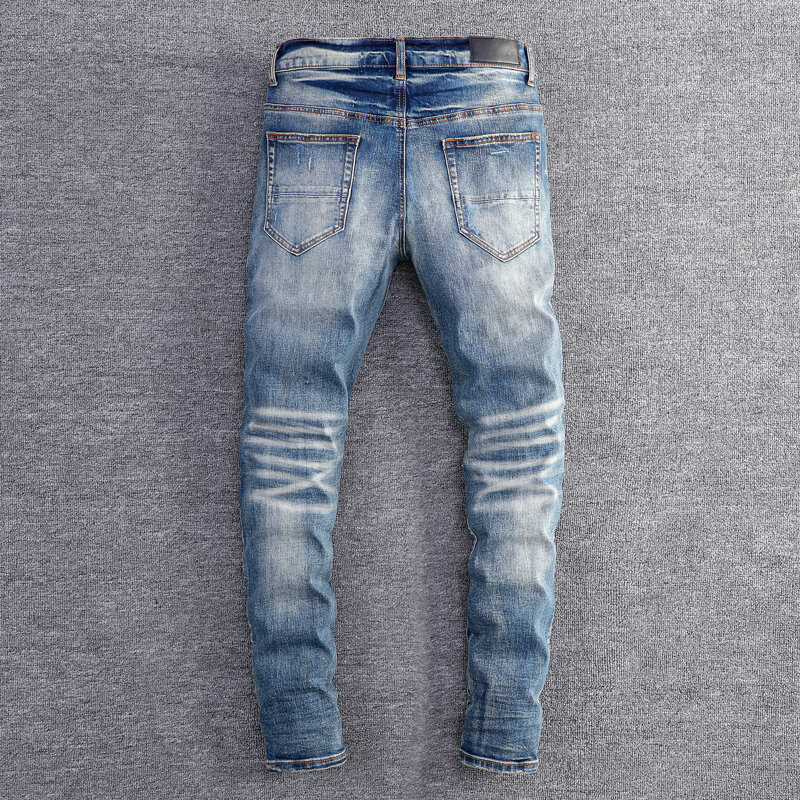 Główna ulica modne dżinsy męskie niebieskie w stylu Retro rozciągaj chudy krój porwane jeansy mężczyzn skórzany projektant Hip Hop markowe spodnie Hombre