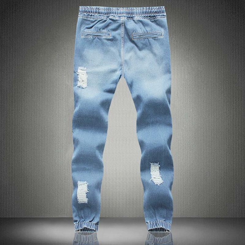 Jeans strappati da uomo tasca con foro pantaloni classici in Denim blu di lusso Slim Fit Jeans Skinny elasticizzati pantaloni a matita pantaloni Streetwear