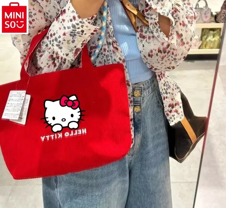 Minio SANRIO การ์ตูน Hello Kitty Corduroy กระเป๋าถือลายพิมพ์น่ารักสำหรับนักเรียนกระเป๋าเก็บของความจุขนาดใหญ่แฟชั่นและลำลอง