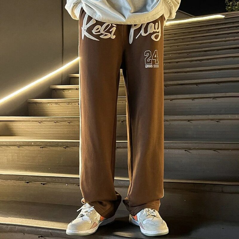 Pantaloni sportivi a contrasto di colore con giunture in stile americano pantaloni a gamba larga con lettera da uomo pantaloni sportivi larghi di marca alla moda di sport di strada