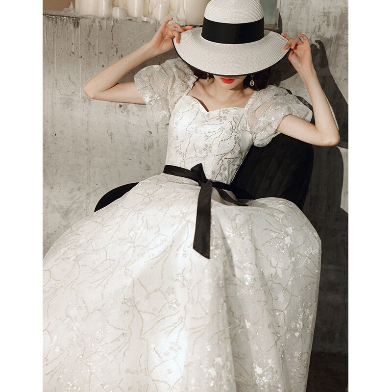 Robe Quinceanera blanche unie pour femme, manches bouffantes élégantes, conception couvertes, robe de soirée, tissu imprimé fleuri, robe trapèze simple