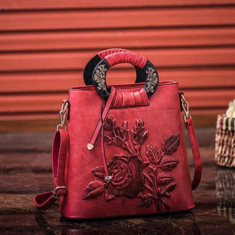 女性のための革のハンドバッグ,ヴィンテージスタイルのバケットバッグ,エンボス加工のプリント,レトロなデザイン,花柄のハンドバッグ,高級トートバッグ
