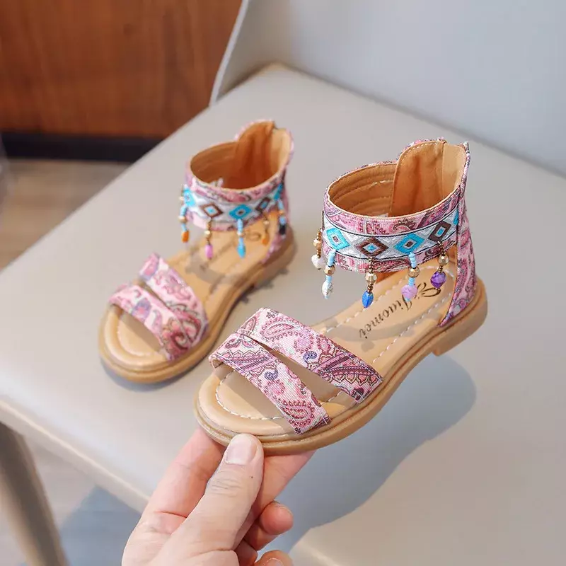 Sandal anak untuk anak perempuan, sandal kasual model Bohemia putri musim panas, sandal Flat modis Retro rumbai, sandal Romawi jari terbuka untuk anak perempuan
