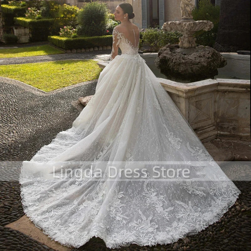 Beautiful and luxurious deep V-neck full of embroidery lace long sleeve mermaid backless mop floor detachable skirt bridal gown
