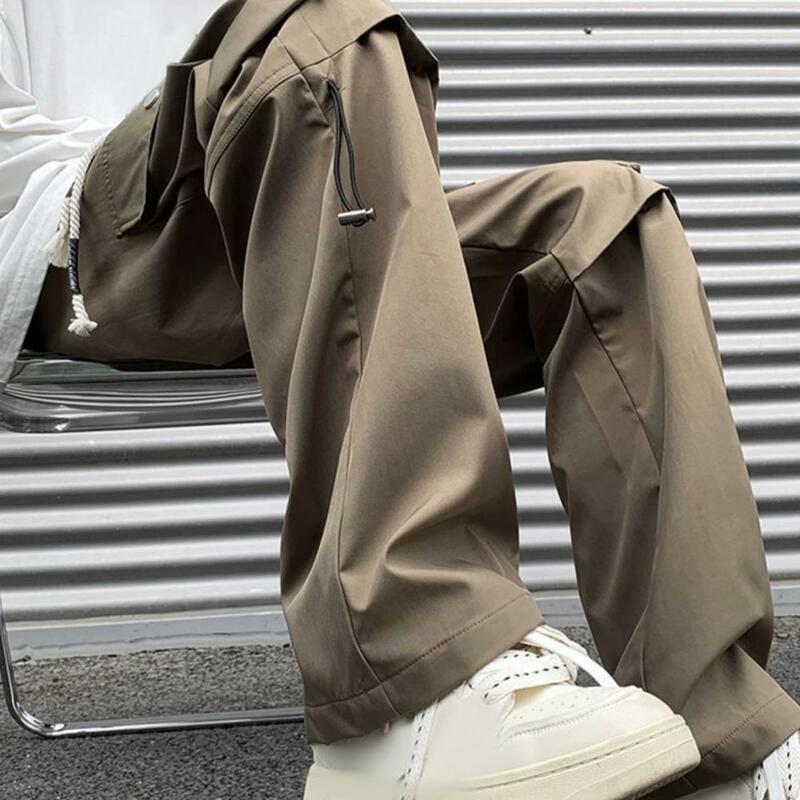 กางเกงเอวรูดเอวสูงสำหรับผู้ชายกางเกงคาร์โก้สไตล์สตรีทสูงพร้อมกระเป๋าหลากหลายขากว้างสำหรับทุกวัน