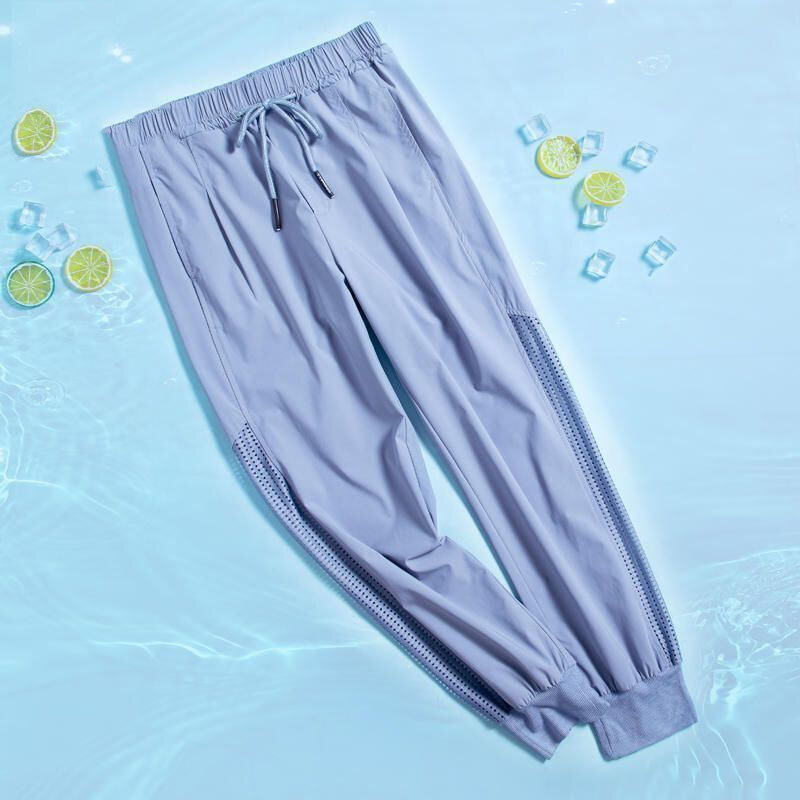 Damskie jednokolorowe modne elastyczne spodnie sportowe ze sznurkiem prostota dorywczo wydrążone przycięte spodnie letnie ubrania damskie