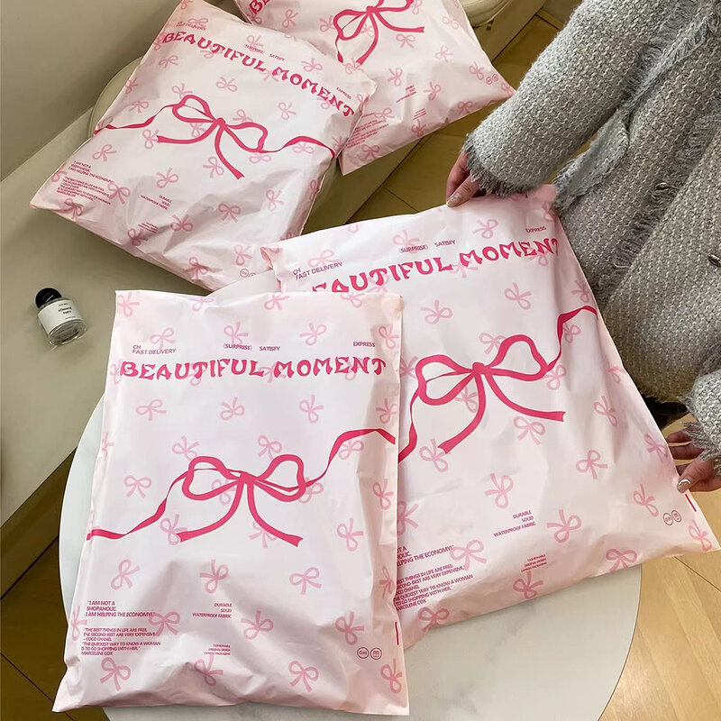 핑크 플라스틱 택배 가방, 활 매듭 인쇄 익스프레스 봉투, 의류 포장, 자체 접착 우편 봉투, 50 개