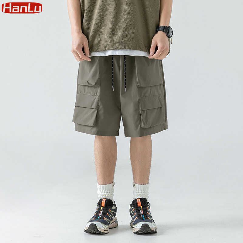 Pantalones cortos holgados hasta la rodilla para hombre, ropa de calle de estilo japonés con bolsillos, estilo Hip Hop, novedad de verano, 2023