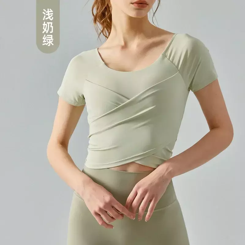 เสื้อโยคะแขนสั้นมีจีบสำหรับผู้หญิงมีแผ่นหน้าอกแบบผสมผสานเสื้อยืดออกกำลังกายแบบแห้งเร็ว