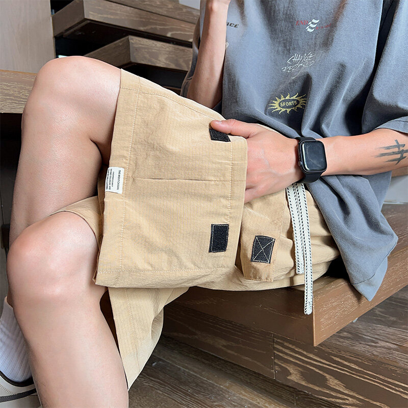 Letnie luźne szorty Cargo męskie dorywczo z wieloma kieszeniami koreańska moda główna ulica ponadgabarytowe krótkie spodnie męskie Streetwear szorty 8XL