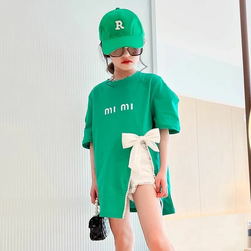 Dziewczęce stroje t-shirty nastolatek z kokardą średniej długości z rozcięciem koreański styl modny Top z krótkim rękawem odzież dziecięca odzież dziecięca