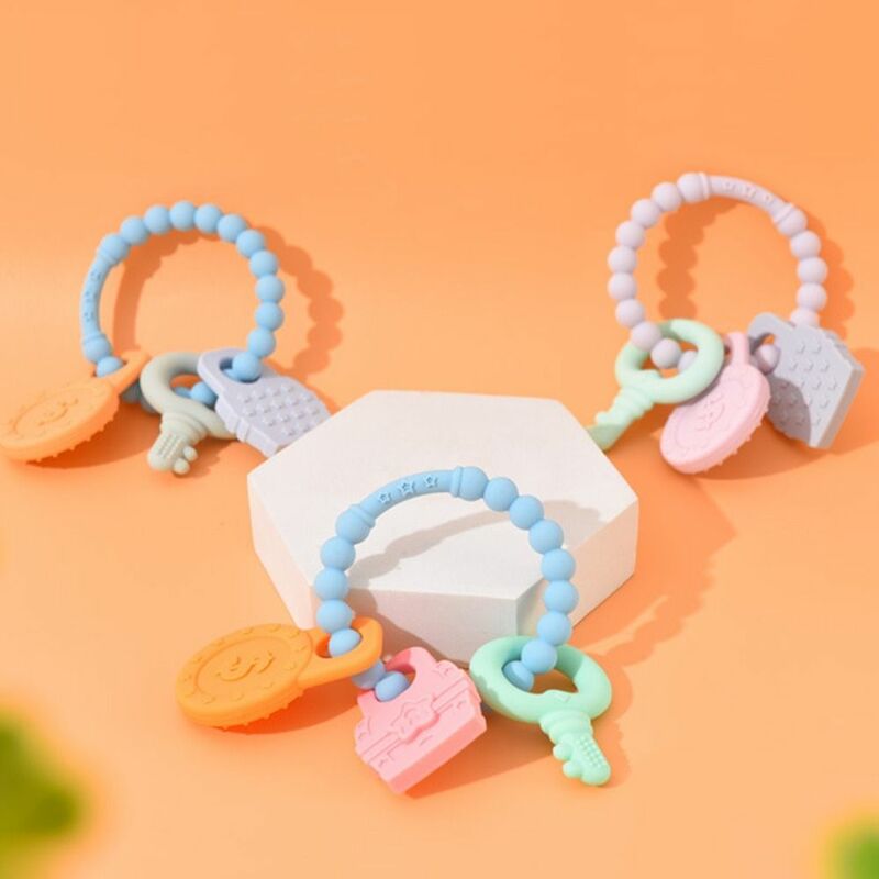 Giocattolo per la dentizione del bambino multicolore portachiavi in Silicone per uso alimentare giocattoli da masticare per bambini Design dell'anello con impugnatura antiscivolo