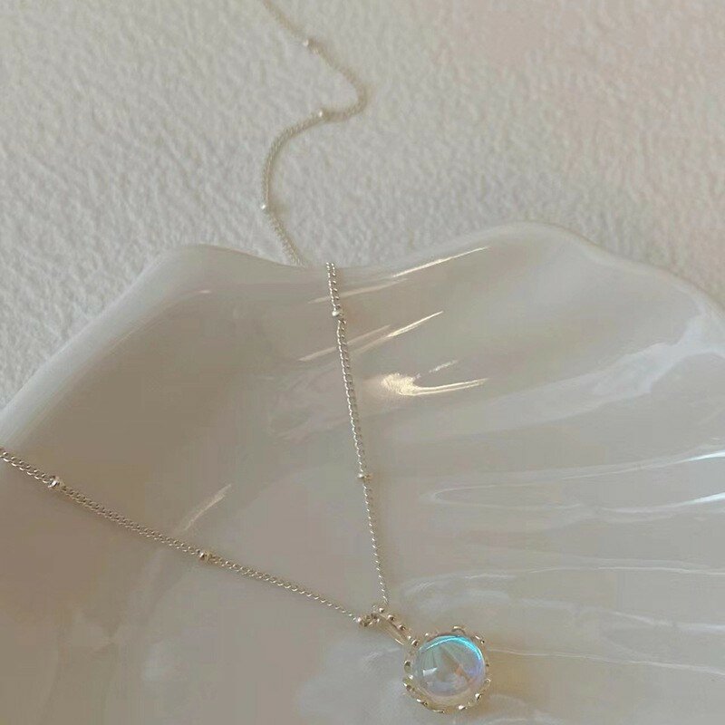 Collar de piedra de luz de luna del Tesoro azul marino, colgante elíptico de diseño de minorrilla femenina, cadena de hueso de serpiente de moda de lujo