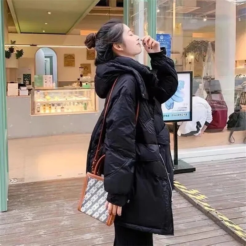 Piumino invernale in cotone 2023 elegante versione coreana cappotto donna sciolto di media lunghezza Versatile con cappuccio per il tempo libero giacche Parka femminili