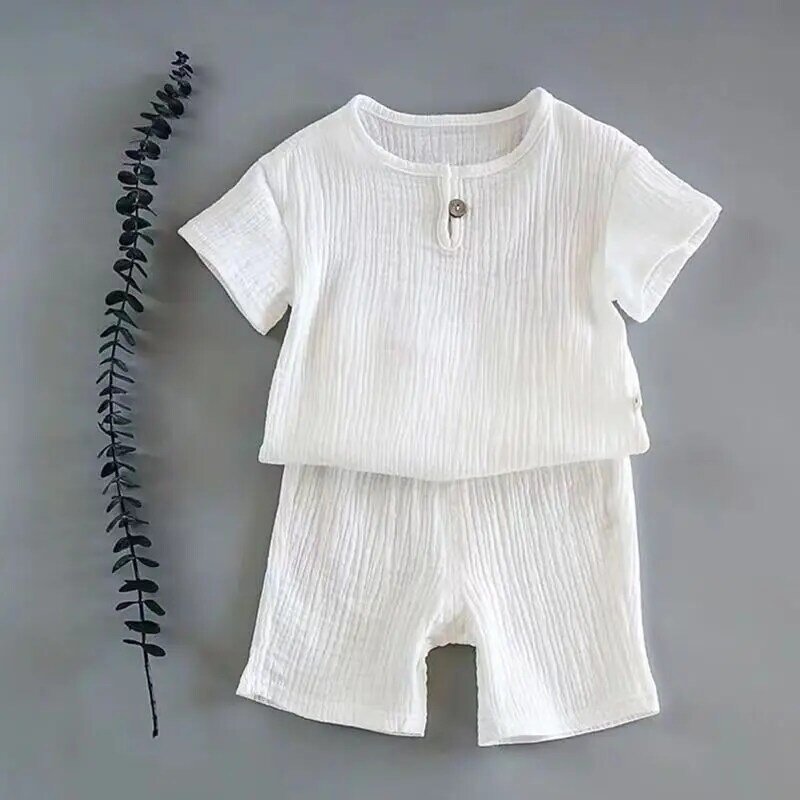 Bawełniana lniana odzież dziecięca dziewczęca strój letni zestawy ubrań dla chłopców jednolity kolor topy z krótkim rękawem szorty odzież dziecięca 2-7 lat