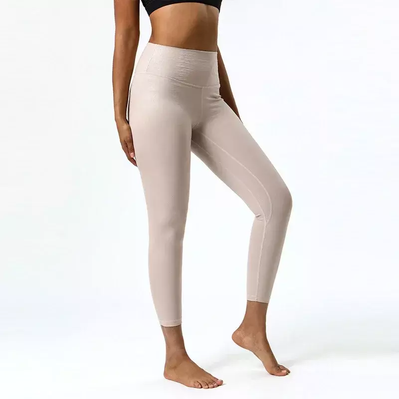 กางเกงโยคะผู้หญิงหนังเทียมยืดหยุ่นสูงกางเกงออกกำลังกายผ้าไนลอนเนื้อหนังใหม่