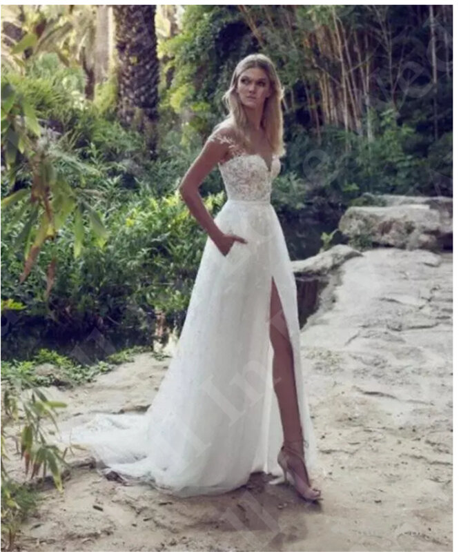 2024 New Boho A-Line Wedding Dress Off Shoulder Lace Appliques Illusion Backless Garden Beach Sweep Train Bridal Gowns Vestidos