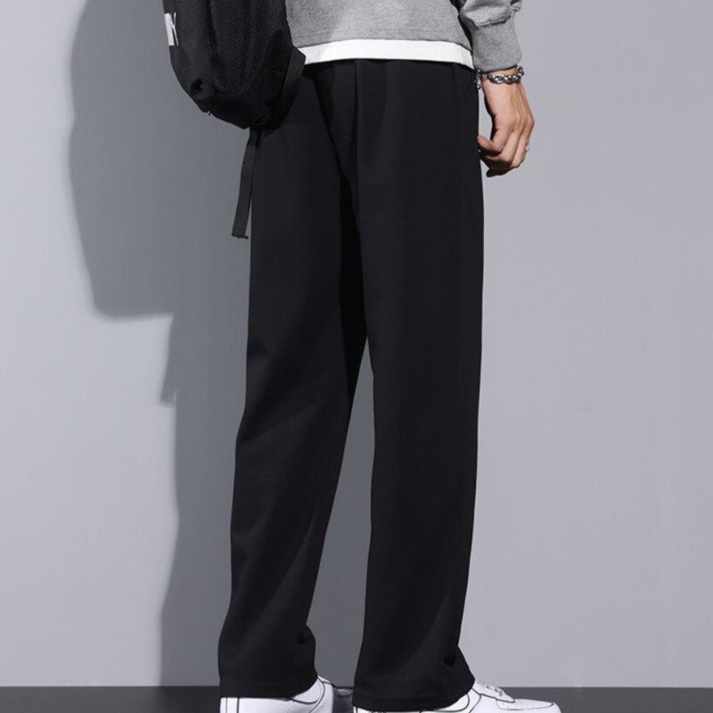 2024 nowa wiosenna i jesienna moda męska spodnie dresowe jednolity, z kieszenią sznurkiem elastyczne w talii casualowe spodnie z luźna szeroka nogawkami