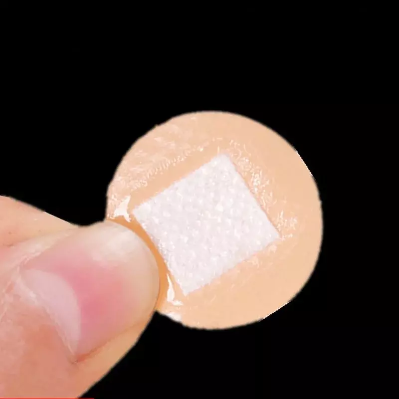 100 sztuk/partia okrągła opaska pomoc w kształcie koła PE nasunięta naszywka na skórę wodoodporne bandaże samoprzylepne oddychające Woundplast