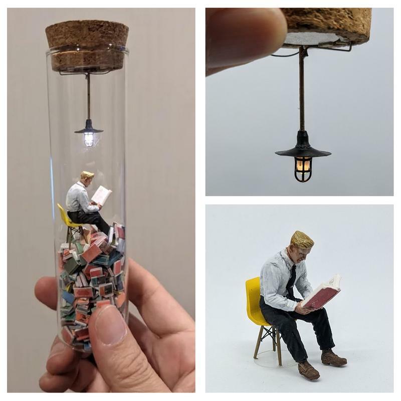 Kreative Reagenzglas Perspektive Zeichnung Harz Siphonat ein Lese mann in einem Reagenzglas Charakter Ornamente Leser Modell