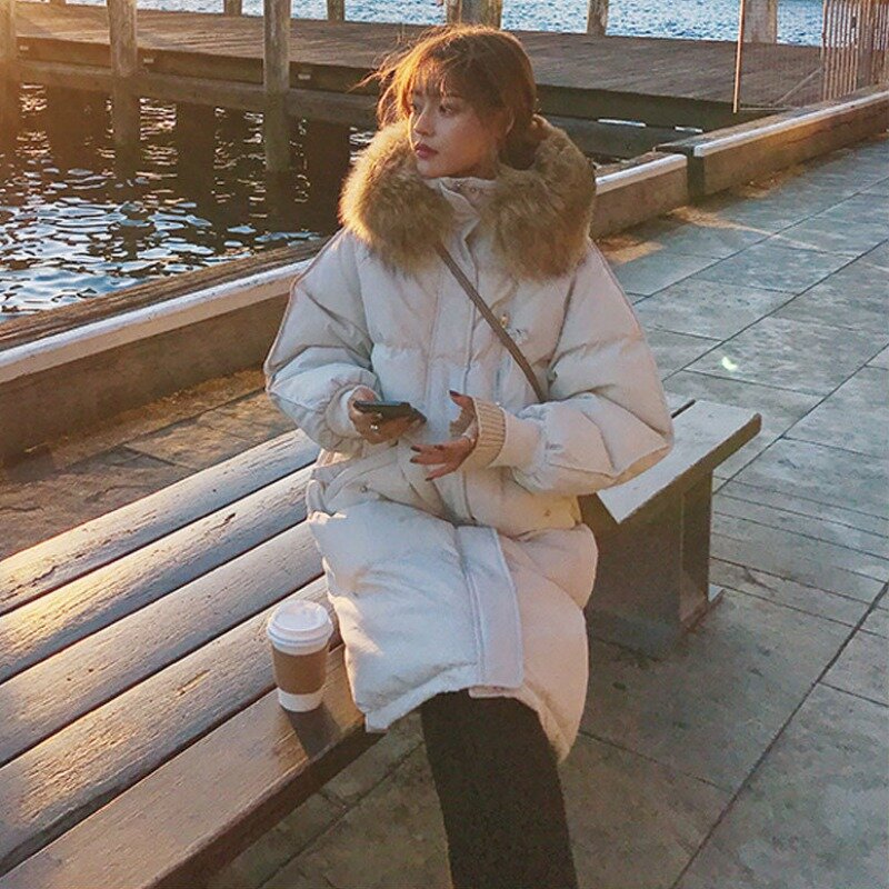 Giacca invernale imbottita in cotone da donna stile coreano collo di pelliccia grande con cappuccio lungo piumino in cotone parka caldo abbigliamento sciolto cappotto donna