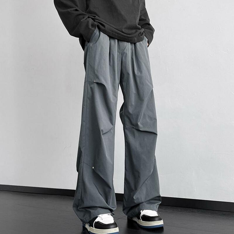 Calças masculinas largas e soltas de perna reta, calças cargo unissex elegantes com decoração rebite, design impermeável para streetwear ou exterior