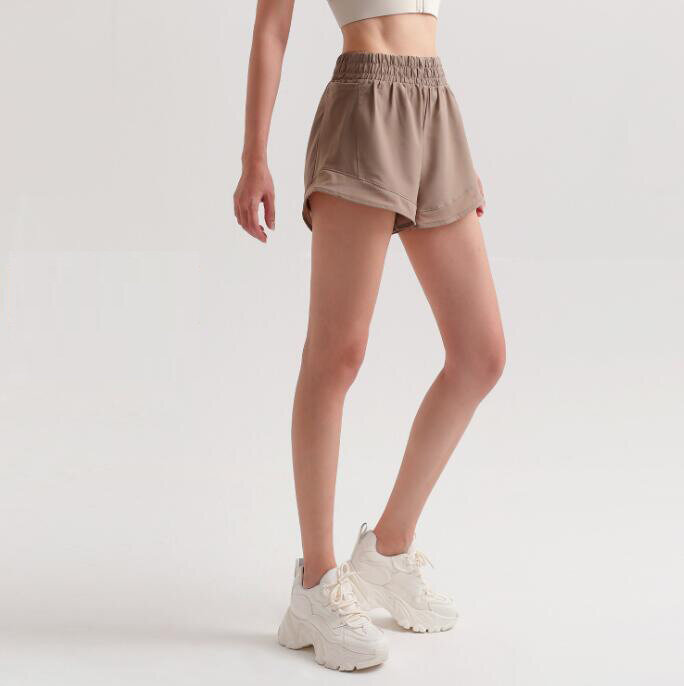 Celana pendek longgar Sporty wanita, bawahan pinggang elastis kasual warna polos musim panas