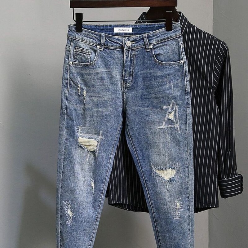 Celana pensil Denim ramping kasual musim semi dan musim gugur celana Jeans pria 2024 baru lubang rusak Slim Fit desain pengemis Jeans dicuci jalan tinggi