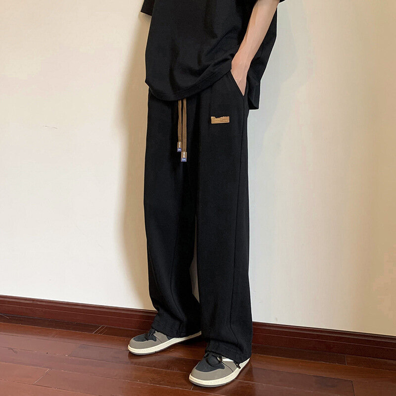 Męskie Super elastyczna spodnie rozciągliwe moda koreańskie, szerokie spodnie męskie luźne dorywczo jednokolorowe męskie spodnie dresowe Streetwear