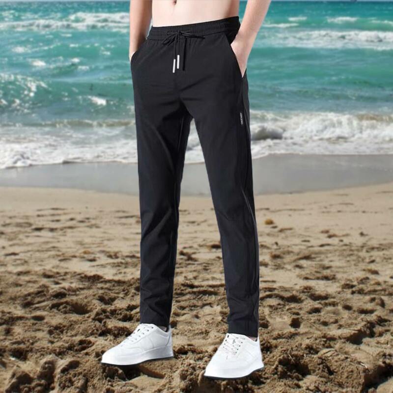 Spodnie męskie Plus Size w jednolitym kolorze Casual na zewnątrz szybkoschnący spodnie z prostymi nogawkami, elastyczne luźne długie spodnie w talii
