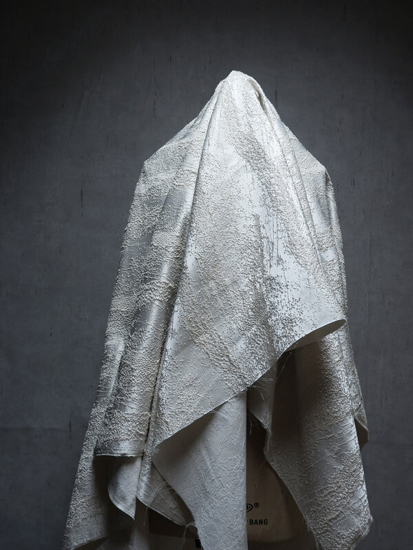 Tessuto di design Jacquard al metro per giacche abbigliamento decorativo cucito fai da te struttura tridimensionale irregolare pianura morbida