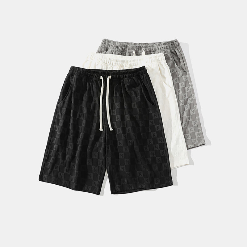 Pantalones cortos de diseño Jacquard para hombre, novedad, pantalones deportivos de playa, cinco puntos, sentido avanzado de verano