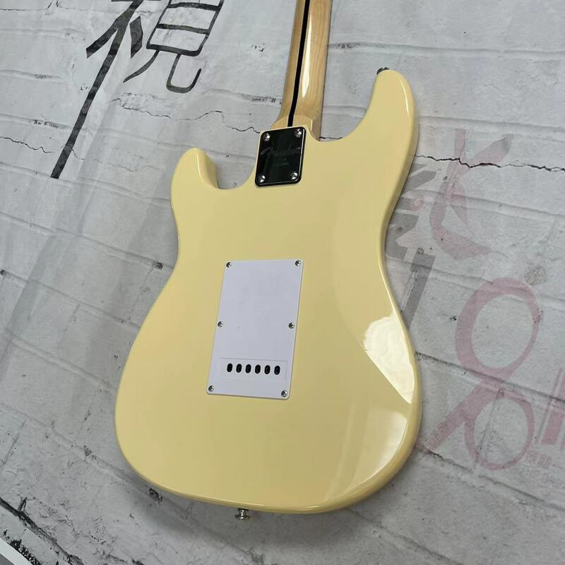 Guitarra eléctrica de 6 cuerdas, cuerpo amarillo, diapasón de arce acanalado, pista de Arce, imágenes reales de fábrica, se puede enviar con un cordón